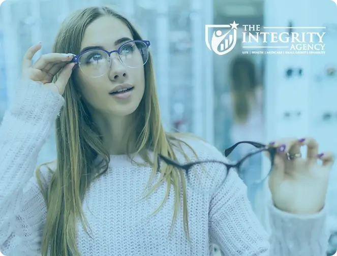 Young woman trying on glasses at a vision center